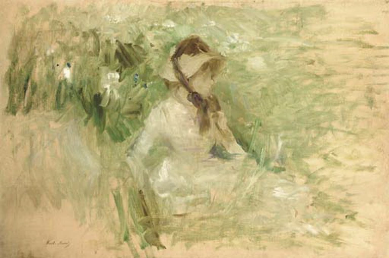 Giovane donna seduta sull'erba